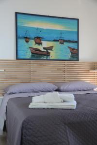 Postel nebo postele na pokoji v ubytování B&B La Dimora di Nonno Lucio
