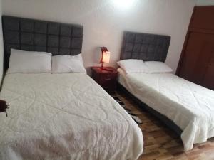 Postel nebo postele na pokoji v ubytování Claudiae