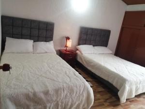 Postel nebo postele na pokoji v ubytování Claudiae