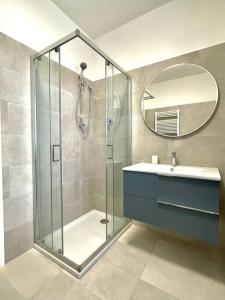 a bathroom with a shower and a sink and a mirror at Casa Vacanze Ca' di Lucchini in San Benedetto Val di Sambro +41 photos