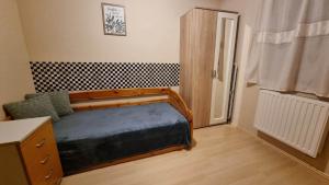 a small bedroom with a bed and a window at Csodaszép in Békéscsaba