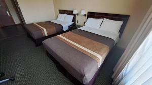 Ένα ή περισσότερα κρεβάτια σε δωμάτιο στο Hotel Diego de Almagro Temuco