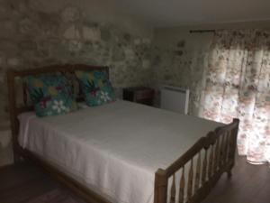 Posteľ alebo postele v izbe v ubytovaní Petite maison sur jardin secret