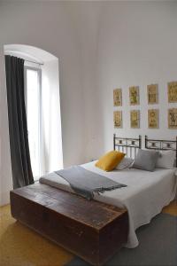 Säng eller sängar i ett rum på Casa Ayroldi