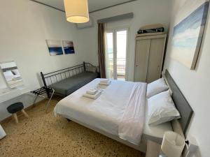Кровать или кровати в номере Sunset view Rooms