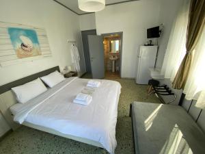 Кровать или кровати в номере Sunset view Rooms