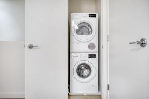 a washing machine and a washer and dryer in a room at Downtown BK 2BR w Terrace WD nr Barclays NYC-658 in Brooklyn