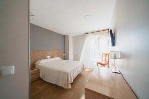 Postel nebo postele na pokoji v ubytování Hotel La Colina