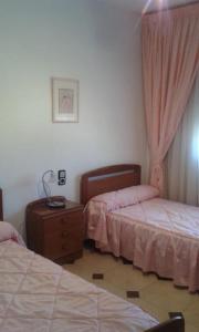 A bed or beds in a room at Casa Lorena