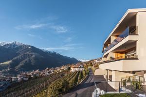 a building with a view of a mountain at Charming Suite by Dornsberg Panoramic Apartments in Schenna