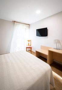 TV a/nebo společenská místnost v ubytování Hotel La Colina