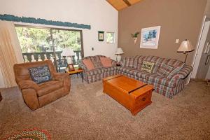 a living room with two couches and a coffee table at 3407 Pine Hill Home in South Lake Tahoe