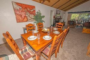 a wooden table and chairs in a living room at 3407 Pine Hill Home in South Lake Tahoe