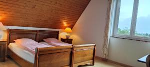 Postel nebo postele na pokoji v ubytování Chambre d'hôtes de la tulipe