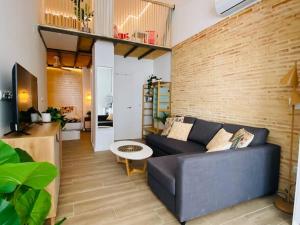 TV a/nebo společenská místnost v ubytování B3 Verdeguer - Cozy Loft Close to the Beach + 11 fotografií