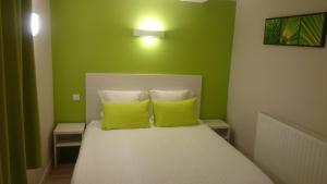 Cama o camas de una habitación en Hôtel Carpe Diem