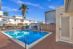 a swimming pool in the courtyard of a house at Hollywood by the Sea in Hollywood