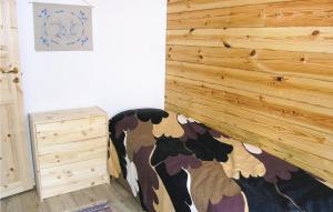 a bedroom with a cow print on the wall at Beautiful Home In Svsj With 3 Bedrooms And Wifi in Gistingstorp
