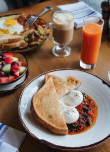 a plate of breakfast food with eggs and toast on a table at W San Francisco in San Francisco