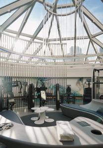 a gymnasium with a large glass ceiling with equipment at W San Francisco in San Francisco