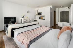 Postel nebo postele na pokoji v ubytování Leonardo50 Apartment + 13 fotografií