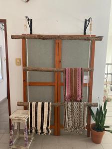 a room with a wooden door with towels on it at Luminoso departamento en Planta Alta in Formosa