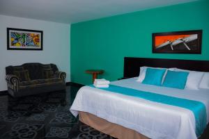 Postel nebo postele na pokoji v ubytování El Oasis Centro Vacacional