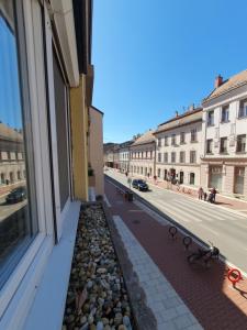 a view of a street from the window of a building at Apartman guru 3 Szeged in Szeged