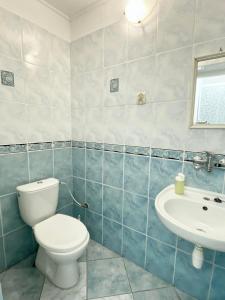 a bathroom with a toilet and a sink at Apartmán Markéta in Bystrzyca