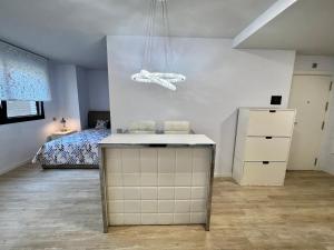 Postel nebo postele na pokoji v ubytování Studio CP Poblenou