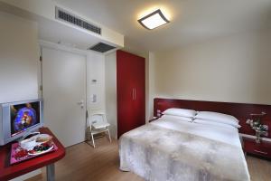 Postel nebo postele na pokoji v ubytování Hotel Pasha