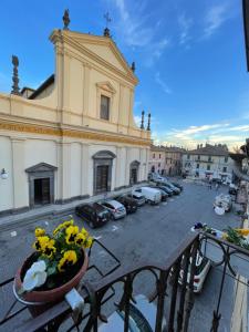 a building with a vase of flowers on a balcony at Casa Di Carla in Canino