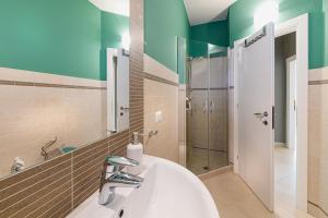 a bathroom with a sink and a shower at Casa Erica in Tirano +6 photos