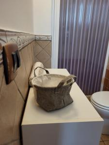 a sink in a bathroom with a toilet at Scorcio Di Mare in Agrigento
