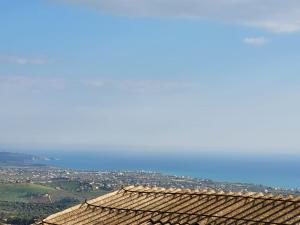 a roof of a building with a city in the background at Scorcio Di Mare in Agrigento