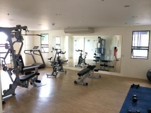 a gym with several treadmills and exercise bikes at Mabolo Garden Flats in Cebu City