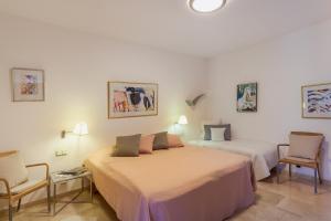 Posteľ alebo postele v izbe v ubytovaní Zen Villa Anfi Tauro Golf with private heated pool