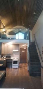 a kitchen with a staircase leading up to a stair case at Best Western Plus Prince George in Prince George
