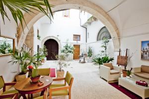 a living room filled with furniture and a fire place at B&B Il Marchese Del Grillo in Sulmona