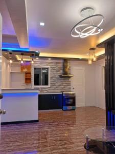 a large kitchen with a large island in a room at Camella Homes in Tagbilaran City