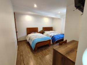Postel nebo postele na pokoji v ubytování linda house cusco