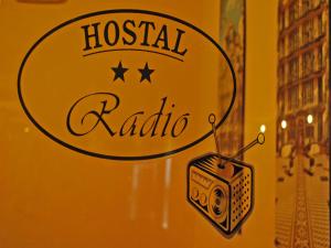a sign that says hospital radio on a wall at Hostal Radio Barcelona in Barcelona