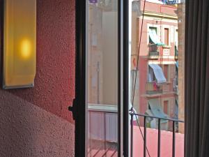 a view of a balcony from a window at Hostal Radio Barcelona in Barcelona