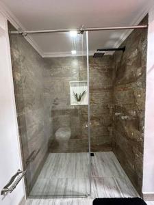 a bathroom with a shower with a toilet in it at Aparta estudio moderno in Envigado