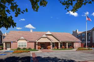 a house with an american flag in front of it at Residence Inn San Jose South in San Jose