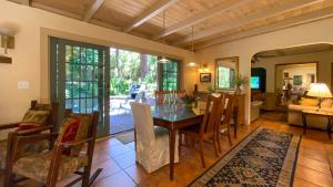 a dining room with a table and chairs at HACIENDA - 3-Bedroom Home home in Jekyll Island +19 photos
