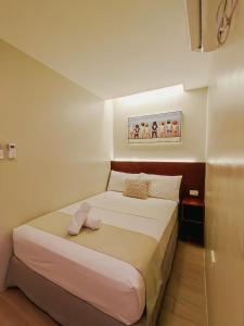 Hotel Simone Kalibo客房内的一张或多张床位