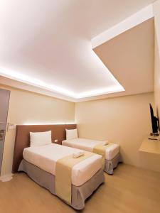 Hotel Simone Kalibo客房内的一张或多张床位