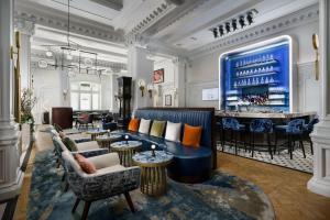 a hotel lobby with a bar in the background at The Algonquin Hotel Times Square, Autograph Collection in New York