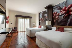 Ein Bett oder Betten in einem Zimmer der Unterkunft Costa Rica Marriott Hotel Hacienda Belen